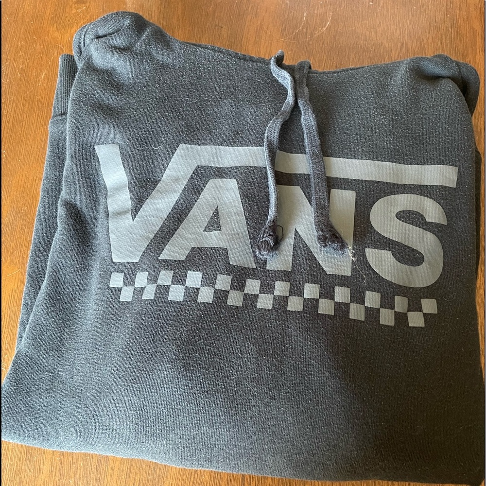 Black Vans sweatshirt.